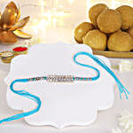 Glittering Grandeur Rakhi & Besan Laddoo Treat