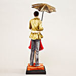 Hugging Couple Under Umbrella Figurine