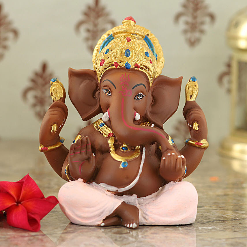 Buy/Send Elegant Lord Ganesha Idol In Pink Dhoti Online- FNP