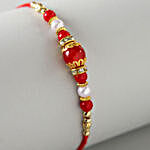 Set Of 4 Pearl Thread Rakhis